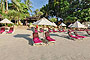 Relaxing chairs on the beach with umbrellas